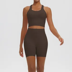 Detailed view of the smooth, breathable dark brown activewear fabric and premium stitching.
