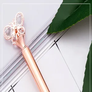 Crystal butterfly metal ballpoint pen detail showcasing delicate design and rose gold finish.