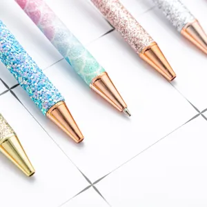 Colorful glitter ballpoint pen with rose gold metal tip, stylish push pen for office and gifts.