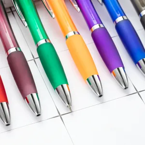 Colorful plastic push ballpoint pens with frosted barrel and metal clip, office supplies.