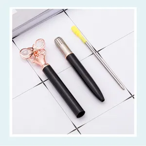 Metal ballpoint pen with crystal butterfly top, sleek black and gold design, ideal student gift.