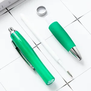 Green retractable ballpoint pen disassembled parts set for office stationery and business gifts.