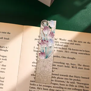 Metal hollow bookmark with tulip flower design and celestial compass motif for reading