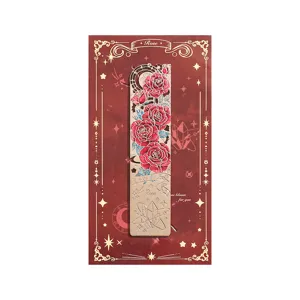Metal hollow rose bookmark with burgundy backing card, elegant floral reading page marker.