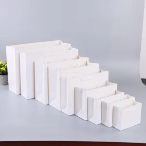 White paper gift bags assortment set, multiple sizes retail shopping paper tote bags.