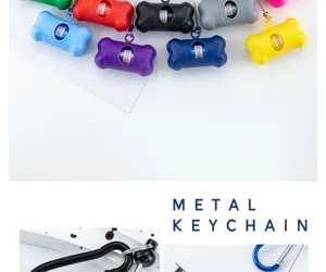 Colorful bone dog waste bag dispenser detail shot featuring durable metal keychain clip.