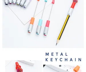 Creative DIY beaded pencil extender metal holder sketch tool craft accessory detail view.