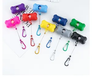 Colorful bone-shaped pet waste bag dispenser with portable hook, ideal for outdoor dog walking.