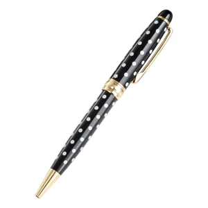 Metal ballpoint pen with black and white polka dots and gold accents for office and school.