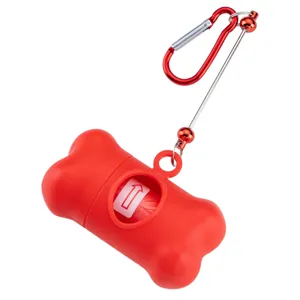 Red bone-shaped dog poop bag dispenser with red carabiner for convenient outdoor pet walking.