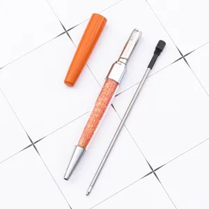 Creative crystal metal ballpoint pen with sparkling glitter refill and stylish orange cap.
