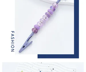 Purple beadable alligator memo clip detail shot, decorative metal desk card holder closeup view.
