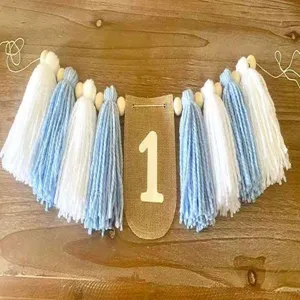 Banner con nappine primo compleanno ghirlanda filato blu bianco decorazione foto