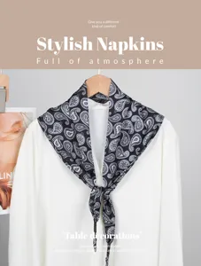 Detailed view of the stylish black and white paisley triangle scarf, soft fabric and elegant drape.