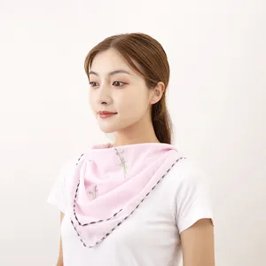 Detail view of pink chiffon sun protection neck cover for women with delicate embroidery.