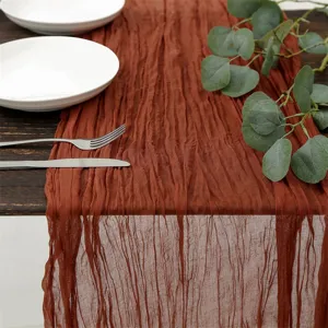 Rustic gauze table runner textured bohemian style decor for wedding party dining table setup.