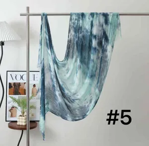 Detailed view of the blue tie-dye modal long scarf, showing soft fabric texture and gradient.