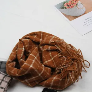Soft brown plaid winter scarf with cozy fringe design, warm knitted check pattern for women.