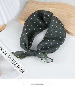 Detailed view of the dark green polka dot cotton linen scarf, elegant styling accessory.
