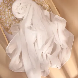 Detailed view of lightweight white sequin scarf, soft breathable fabric texture for women.