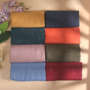 Detail view of soft breathable women sequin scarf featuring shimmering glitter dots and rich colors.