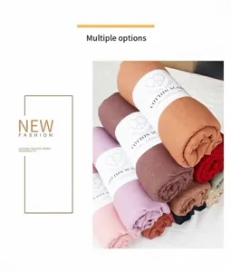 Solid color cotton linen scarf rolled up in multi colors, soft and warm autumn winter accessory.