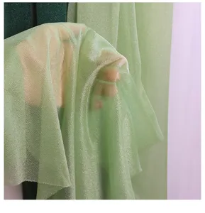 Green sparkly tulle fabric detail for wedding background arch decoration and party decor.