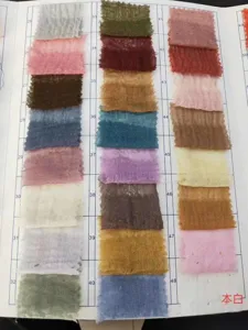 Cotton linen scarf fabric color swatch card showing various shades with natural wrinkles.