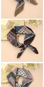 Close-up details of vintage paisley printed small square scarf, retro block pattern, soft fabric.