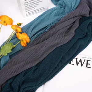 Detailed view of women pleated shimmer scarf, breathable casual solid hijab accessory.
