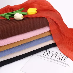 Detailed view of multi-color pleated scarves with metallic threads for stylish women fashion.