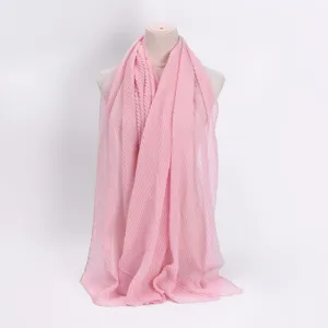 Pink pleated crinkle hijab scarf, lightweight breathable cotton linen headscarf detail.