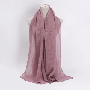 Detailed view of the pleated shimmer hijab scarf, featuring soft fabric texture and fine glitter.