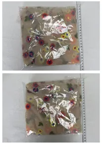 Transparent mesh embroidered table runner with colorful floral pattern for home decor.