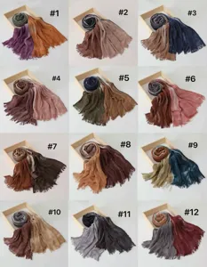 Modal cotton gradient scarf detail showing multiple color variants in neat tray display.