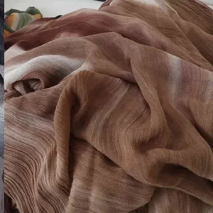 Close-up detail of soft modal cotton crinkled scarf with gradient brown texture