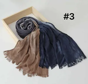 Detailed close-up of gradient cotton modal scarf with elegant tassels and soft texture.