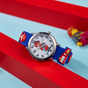 Montre quartz enfant dessin anime pompier avec aiguilles lumineuses et bracelet en silicone bleu