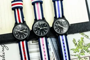 Stylish nylon strap quartz watch with luminous dial and 24-hour markers for kids students.