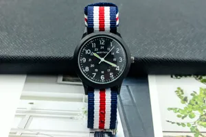 Military nylon strap watch with luminous hands and clear dial for daily wear.