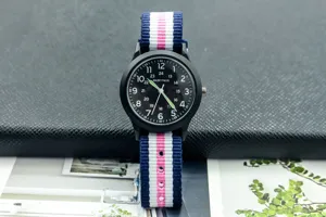 Children quartz watch with black dial and colorful nylon strap military field style detail