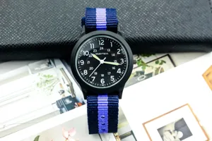 Stylish nylon strap quartz military watch with black dial and luminous hands for men boys.