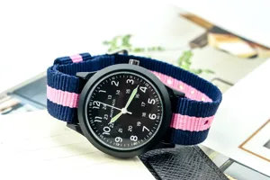 Casual nylon strap quartz watch with black dial and luminous hands for outdoor wear.
