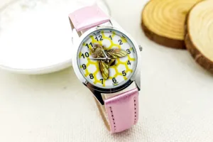 Children's pink leather strap quartz watch featuring cute bee honeycomb dial design detail.