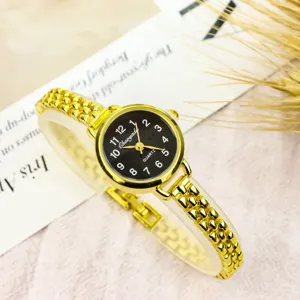 Gold small dial quartz watch for women, stylish minimalist chain bracelet timepiece.