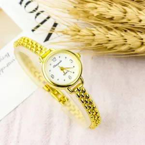 Minimalist small dial quartz watch for women with stylish gold chain bracelet strap design.