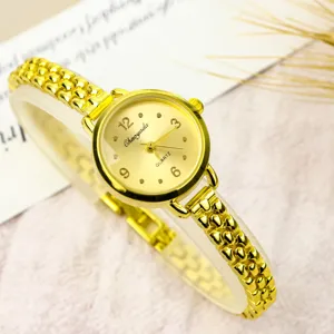Minimalist small dial quartz watch for women with stylish gold chain strap and elegant design.