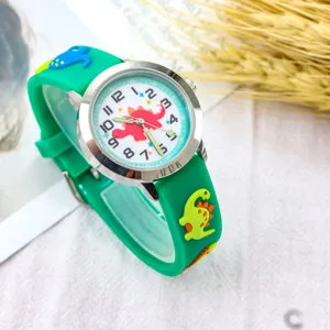 Kids green dinosaur watch detail showing cute 3D cartoon strap and clear dial numbers.