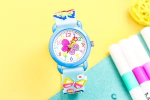 Cute 3D butterfly kids quartz watch detail showing colorful dial numbers and soft strap.