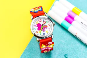 Children quartz watch detail view, cute 3D butterfly strap design, colorful dial numbers.
